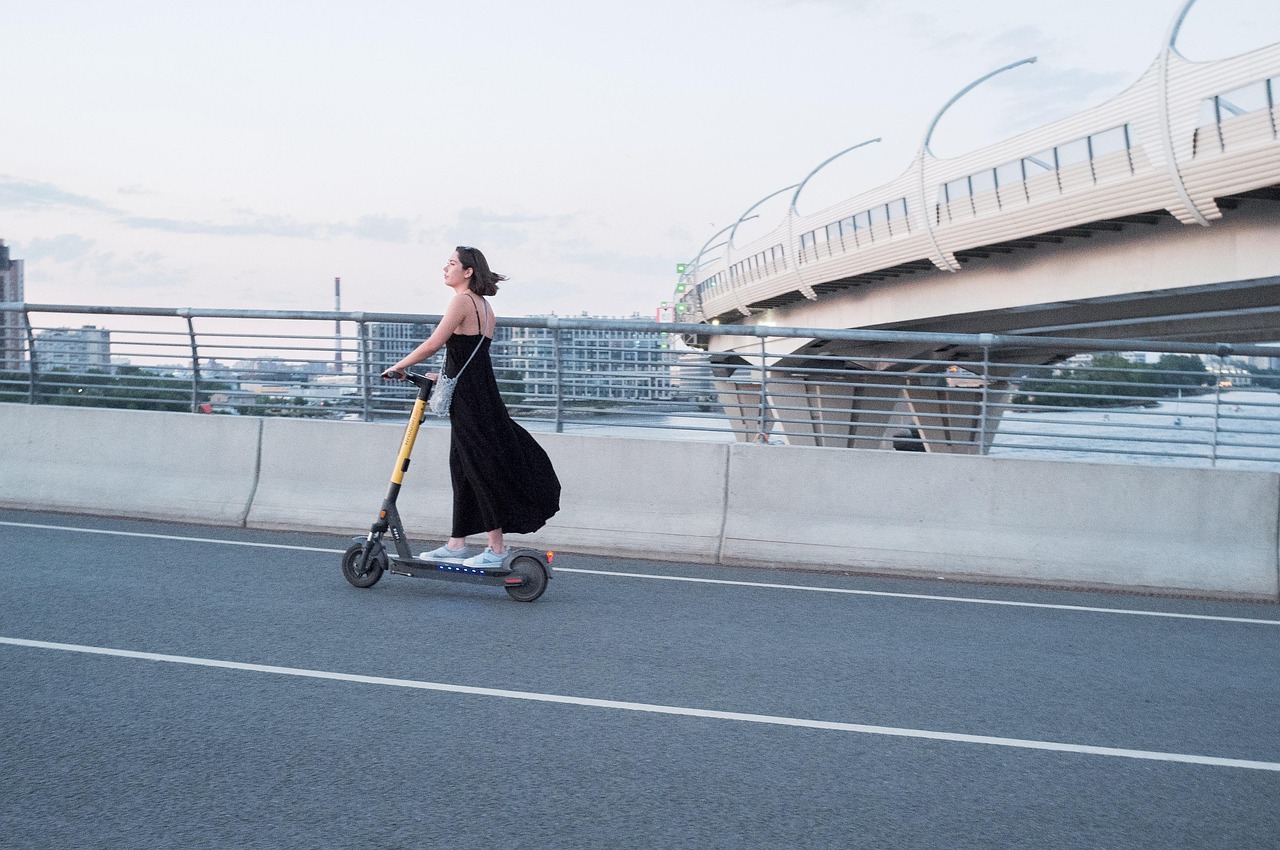 Woman, electric scooter, street — Futuristic: Navigating the Dawn of Tomorrow