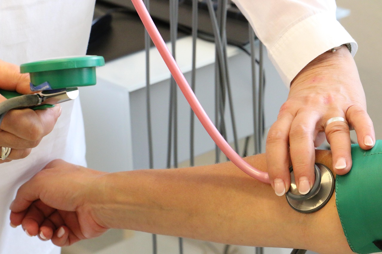 Doctor, examination, blood pressure — Improve Patient Access to Care With Health Economics Outcomes Research