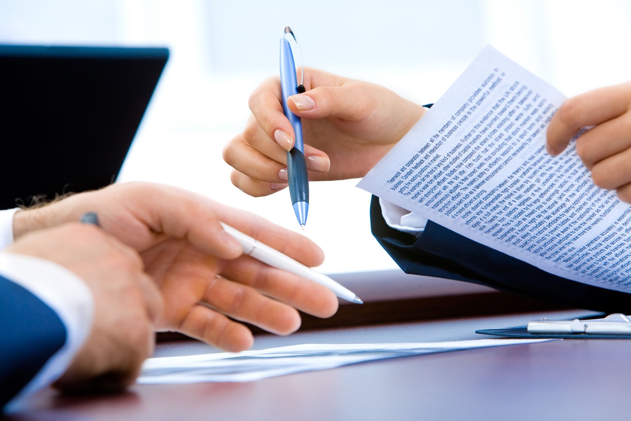 Laptop, office, hand — Job Distribution: Optimizing Workload Management in Modern Organizations