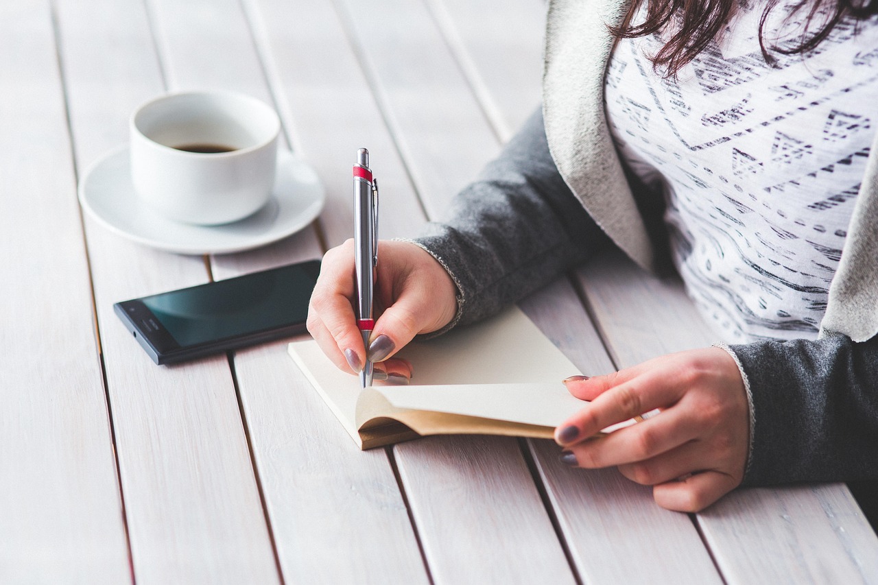 Woman, write, notepad — Nano Wallet Ensures Safe Cryptocurrency Storage